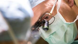 Carlos Heras-Palou, 53, performing hand surgery at Derby Nuffield Hospital. Mr Heras-Palou, an orthopaedic specialist surgeon, may have had his career saved by a new drug called 'Patisiran'. The rare disease, hereditary transthyretin-mediated amyloidosis 