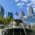 Berczy Park Dog Fountain and surrounding urban skyline cityscape of downtown Toronto, Ontario, Canada.