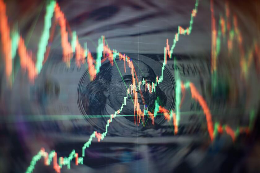 Charts of financial instruments with various type of indicators including volume analysis for professional technical analysis on the monitor of a comp