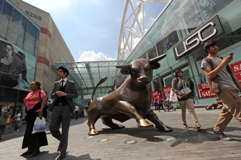 Shoppers at the entrance to the Bullring Shopping Centre in Birmingham England Uk