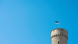 Estonia flag tallinn, view of the flag of Estonia on top of the Pikk Hermann tower on Toompea Hill in the center of Tallinn, Estonia.
