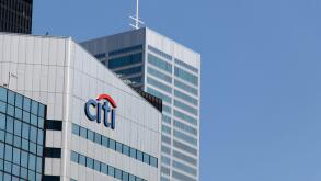 The Citi bank, Citigroup logo atop of an office building in downtown Toronto, seen on a clear and blue sky day.
