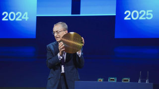 Intel CEO Pat Gelsinger holds aloft a wafer of Panther Lake processors