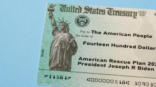 US Treasury illustrative check to illustrate American Rescue Plan Act of 2021 payment on blue background