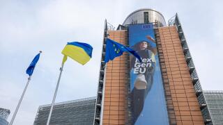 BRUSSELS, Belgium -May 7, 2022: Ukrainian and European flags blowing in front of the seat of the European Commission