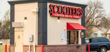 A female customer at Scooter's Coffee Drive-Thru shop on Maple Avenue, Wichita, Kansas, USA.