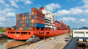 Panama Canal, Panama - March 17, 2014: A cargo ship in the Miraflores Locks in the Panama Canal, in Panama