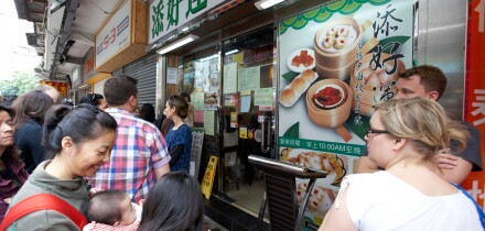 people queuing outside former one dim sum tim ho wan michelin starred restaurant location in mong kok district kowloon hong kong hksar china