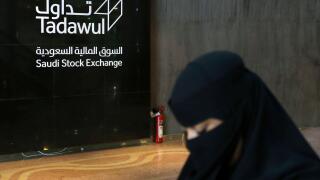 A Saudi woman walks at the Saudi stock market (Tadawul), in Riyadh, Saudi Arabia March 9, 2020.  REUTERS/Ahmed Yosri