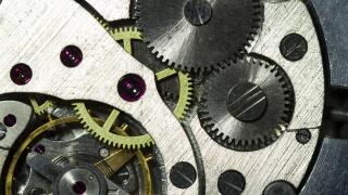 Vintage watch movement close-up. Showing cogs, wheels and jewels.