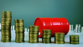 Oil price drop. Red barrel and money.