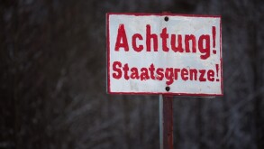 Sign with the inscription warning national border, Germany