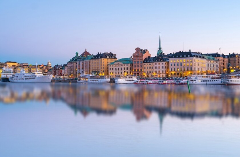 Stockholm skyline with reflection at night in Stockholm city, Sweden.