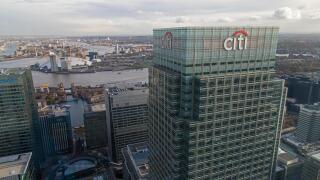 UK headquarters of CITI bank at 25 Canada Square, Canary Wharf, London, with the O2 arena and River Thames in the background.