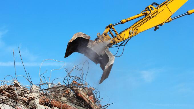 Demolition crane dismantling a building