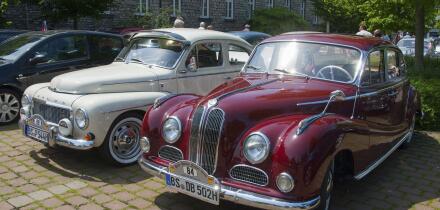 Two vintage cars in red and white parked next to each other in the shade, vintage car, Volvo PV 544, 1964, and BMW 502, 2600 L, 1962, Lower Saxony, Ge