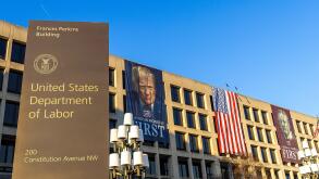 United States Department of Labor headquarters in Washington, DC, with banners of Donald Trump and Theodore Roosevelt reading "American Workers First"