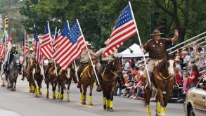 County Sheriff Horse Patrol Carrying American Flags in Independence Day Parade Corydon Indiana