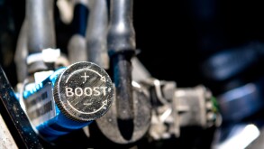 A close up of the detail of an adjustable boost controller in a car modified to produce more power.