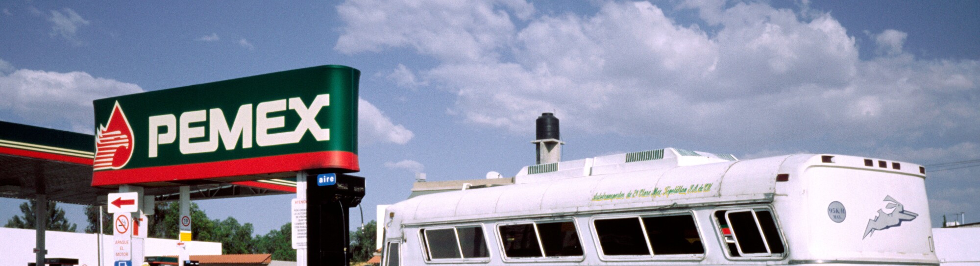 Feb 28, 2002 - Overland coach at a PEMEX filling station in Texcoco outside Mexico-City.