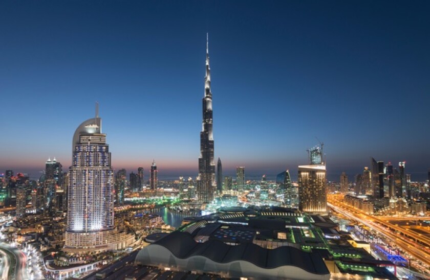 Burj Khalifa , the Dubai Mall and skyline of Downtown Dubai at night in United Arab Emirates