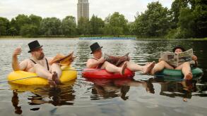 Businessmen dressed in mankinis float on rubber rings on the Serpentine in Hyde Park, central London, during a photocall for new 'community led' mobile phone company giffgaff.