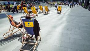 Aviva PLc HQ Headquarters London . Aviva sponsored deck chairs outside the Aviva St Helen's bldg, formerly Aviva Tower, St Mary Axe, City of London.