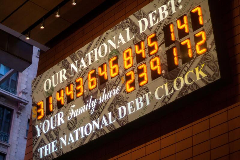 The National Debt Clock in the AnitaOs Way arcade in Times Square in New York on Tuesday, May 17, 2023. President Biden and congress are negotiating on a bill to raise the debt ceiling before June 1 when the US would start defaulting on its obligations. (