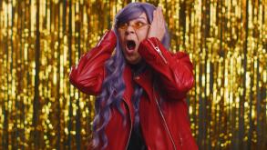 Woman with purple hairstyle screams from stress tension problems feels horror hopelessness fear surprise shock expresses gestures rage. Senior grandmother isolated on shiny disco party foil background