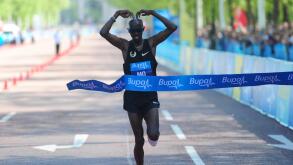 Athletics - 2013 Bupa London 10k - London. Mo Farah crosses the line to win the Bupa London 10k run, London.