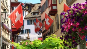 Switzerland, Zurich, old city, street and flag.