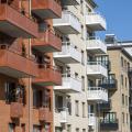 Red and white apartment blocks with many balconies in Berlin, Germany, Europe