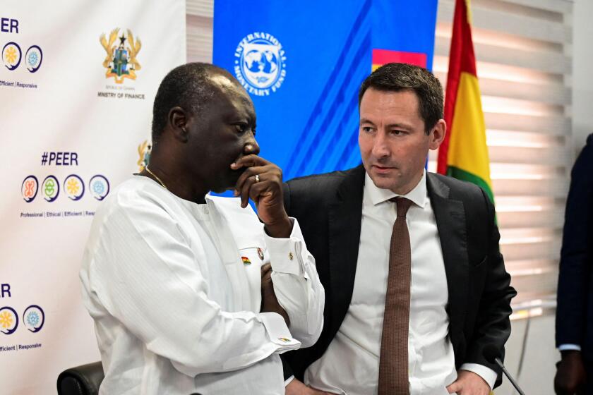 Ken Ofori-Atta, Ghana's finance minister, and IMF Mission Chief Stephane Roudet