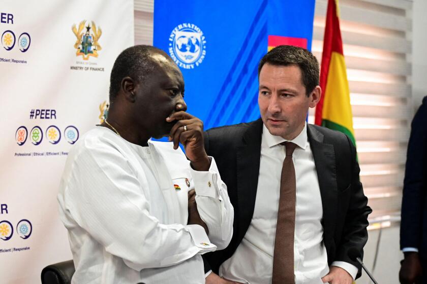 Ken Ofori-Atta, Ghana's finance minister, and IMF Mission Chief Stephane Roudet