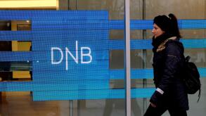 A woman walks past DNB bank branch in Stavanger, Norway December 5, 2019. REUTERS/Ints Kalnins