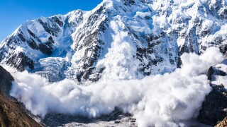 Power of nature. Real huge avalanche comes from a big mountain, Shkhara, 5.193 m, Caucasus, Kabardino-Balkaria, Bezengi region, Russia
