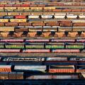 marshalling yard for railway cargo trains in Budapest. This is on Ferencvaros district. Aerial photo about lot empty and full trains.