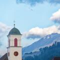 Church tower and mountains in Mauren, Liechtenstein