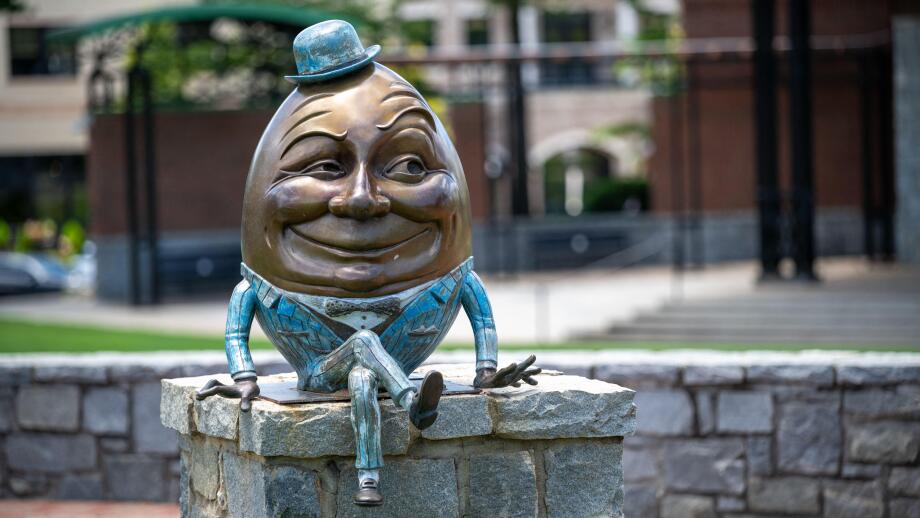 Humpty Dumpty statue sitting on wall in Suwanee Town Square, Suwanee, Georgia