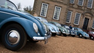 Vintage VW Beetle cars parked outside Standford Hall. Leicestershire, England