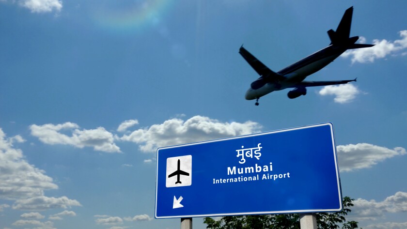 Plane landing in Mumbai, Bombay India, Maharashtra airport with signboard