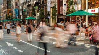 TOKYO, JAPAN - JULY 30 2023: Long exposure motion blurred image of shoppers in the high-end shopping area of Ginza in central Tokyo, Japan