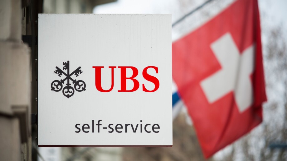 A "Self Service" sign is hanging outside an ATM branch of Switzerland's largest bank UBS in Zurich, Switzerland.