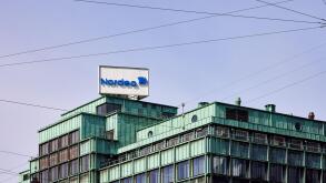 Nordea Bank sign on top of office building Vesterport (designed by Povl Baumann & Ole Falkentorp, 1932); Copenhagen, Denmark
