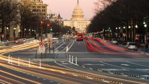 Traffic creates light trails and motion blurs leading to the US Capitol Building on Pennsylvania Avenue in Washington, DC.