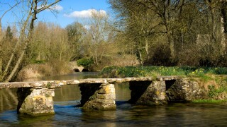 St.John's Bridge, a clapper bridge in Eastleach in Gloucestershire, Cotswolds, England, UK over the River Leach.. Image shot 03/2006. Exact date unknown.