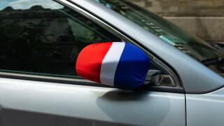 Paris, France, 2018. A sleeve in the colors of the French flag on a car's rearview mirror to celebrate the French 2018 soccer World Cup