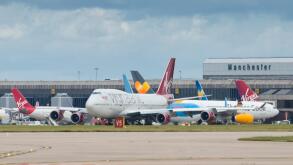 A general view of Manchester Airport runway including a Virgin Atlantic Boeing 747 in the foreground.