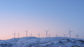 View at the wind turbines farm in Norway in winter.