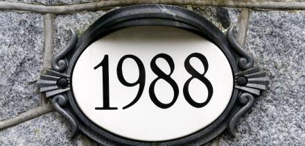 1988 house number on ornate oval plaque